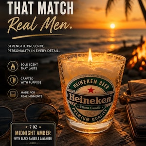 May include: A lit candle in a Heineken beer glass with the text "CANDLES THAT MATCH Real Men." The candle is 7 oz and scented with Midnight Amber, black amber, and lavender. The background shows a sunset over the ocean.