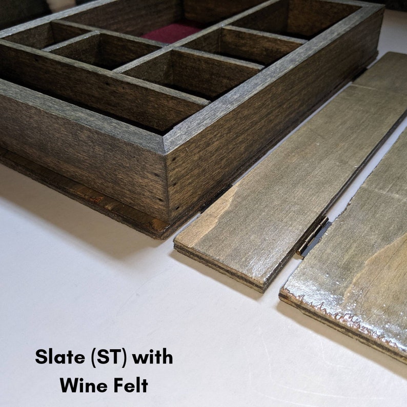 May include: A wooden box with a hinged lid and a removable tray. The box is stained a dark gray color and has a red felt lining in the tray. The box is labeled "Slate (ST) with Wine Felt".