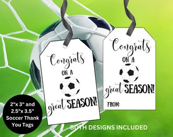 May include: Two white soccer thank you tags with black text and a black and white football graphic. The text on the tags reads "Congrats on a great season!" and "From:". The tags are 2 inches by 3 inches and 2.5 inches by 3.5 inches.
