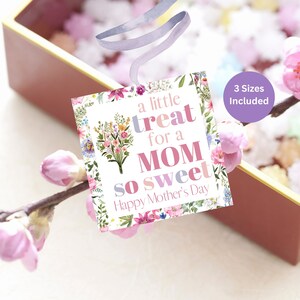 May include: A floral gift tag with the text "a little treat for a MOM so sweet Happy Mother's Day". The tag is white with pink, purple, and green floral illustrations.