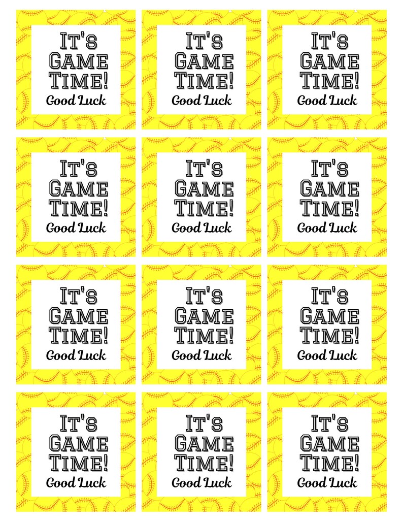 May include: A sheet of softball-themed gift tags. Each tag has a white square with the text "IT'S GAME TIME! Good Luck" in black. The background is yellow with a softball pattern.