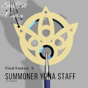 May include: A gold-colored Summoner Yuna Staff from Final Fantasy X, a 3D model. The staff features a circular design with intricate cutouts and a pointed tip with a blue handle. The text "Star Fall Cosplay" is in the upper left corner.