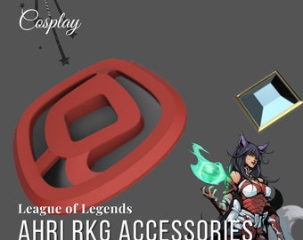 May include: League of Legends Ahri RKG Accessories 3D Model. A red 3D printed model of the League of Legends Ahri RKG symbol. The symbol is a stylised letter "A" with a curved line around it. The model is on a grey background.