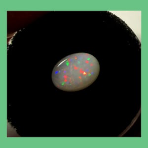 AUSTRALIAN WHITE OPAL – Coober Pedy South Australia – 9 x 7 mm Oval Cabochon – Red with Rainbow Flash - Made in Maine