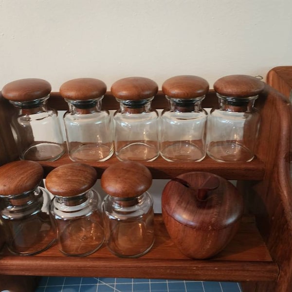 Vintage teak shelf eight spice bottles teak lids  paper towel holder/spicerack combo and two teak frames.