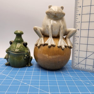 Two frog  figures sculpture