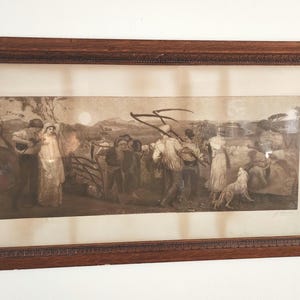 May include: A framed sepia-toned print depicting a group of people in a rural setting. The scene shows a group of people, some carrying scythes, walking through a field. A dog is in the foreground. The print is framed in a dark wood frame.