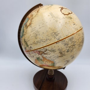 Vintage Replogle  mini globe nine inch diameter walnut base made in USA raised mountain