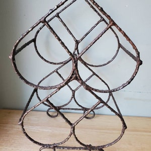 Mid century modern Brutalist double heart shaped wine rack holds 4 bottles