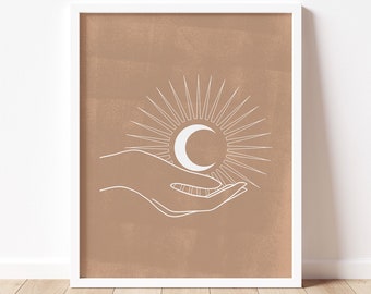 May include: A minimalist art print with a brown background and a white outline of a hand holding a crescent moon with sun rays emanating from it.