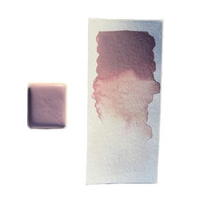 May include: A watercolor paint swatch and a square paint block. The swatch shows a gradient of a dusty rose color, and the paint block is a solid dusty rose color. The background is white.