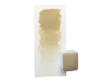 Può includere: Un campione di pittura ad acquerello nelle tonalità del beige e del marrone chiaro, accanto a una pastiglia di vernice quadrata. Il campione di pittura mostra la sfumatura del colore da scuro a chiaro. La pastiglia di vernice è di colore beige chiaro.