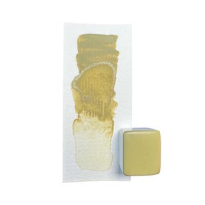 May include: A gold watercolour paint swatch on white paper, showing colour variation. A small, square, pale yellow paint block sits next to the swatch. The paint has a metallic sheen.
