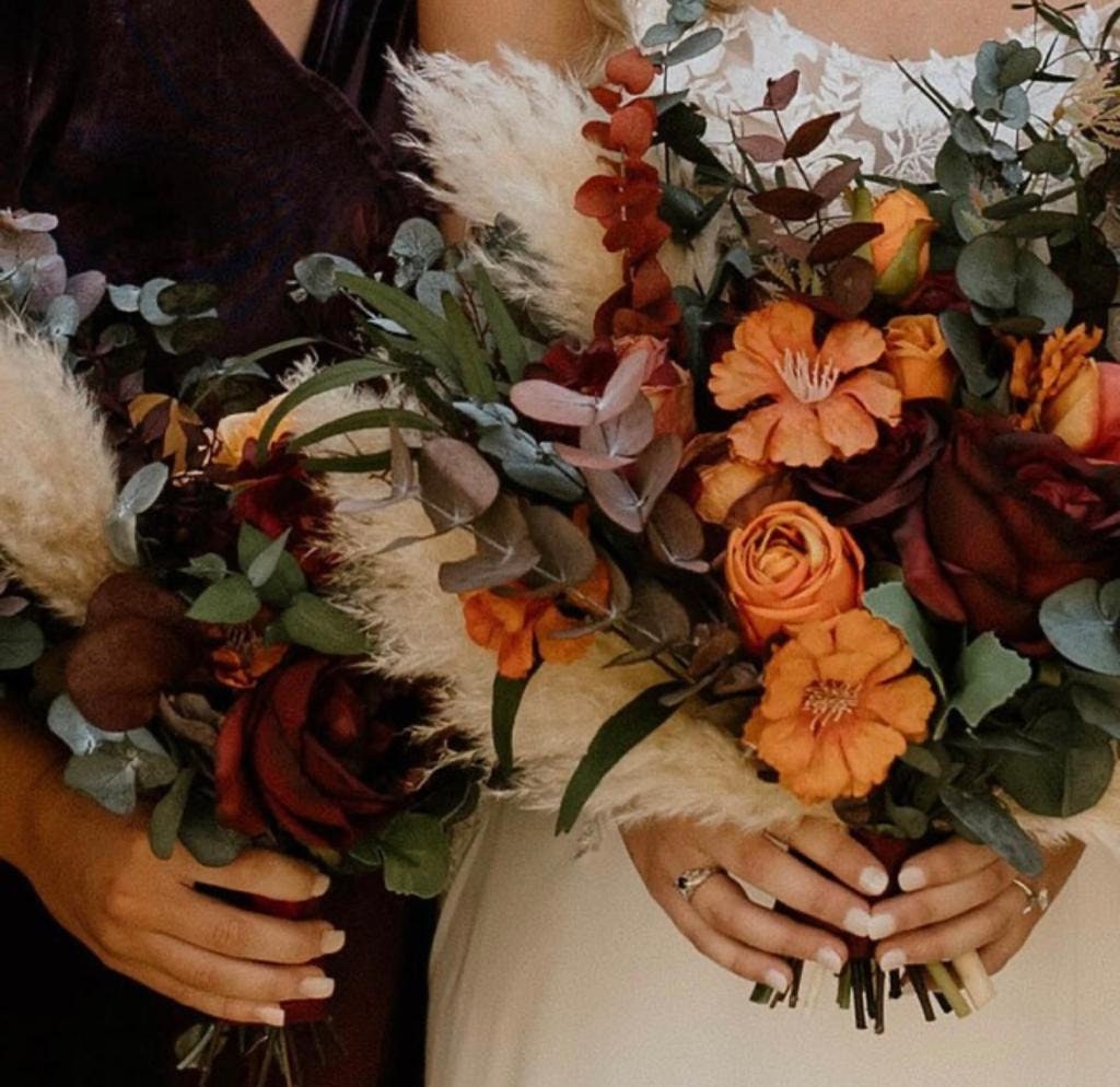 Free Photo  Fall winter bouquet with hot flowers and cinnamon sticks