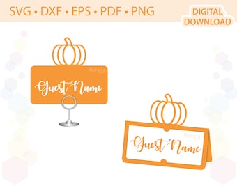 May include: Two orange pumpkin-shaped place card holders with the text "Guest Name" on each. The place cards are designed for a fall or Thanksgiving themed event.