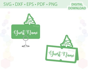 May include: Two green place card holders with a pine tree design. The place cards say "Guest Name".