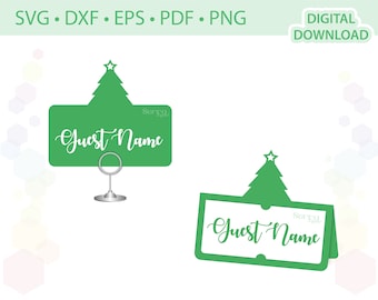May include: Two green Christmas tree place card holders with the text "Guest Name" on each. The place cards are designed to be used with a table setting.