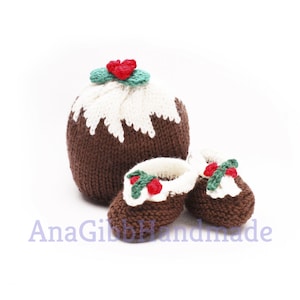May include: A knitted Christmas pudding hat and booties set. The hat is brown with a white top and green holly accents. The booties are brown with white trim and green holly accents.