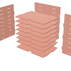 May include: A wooden storage box with a stack of 8 removable shelves. The box has a light brown color and is made of wood. The shelves are designed to hold small items, such as jewelry, craft supplies, or other small objects.