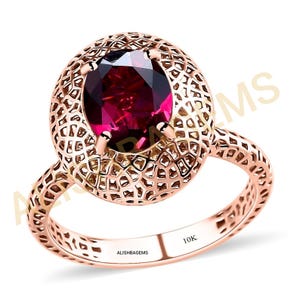 Large Rhodolite Garnet Halo Ring: 10K Yellow Gold, Size 9x7 MM
