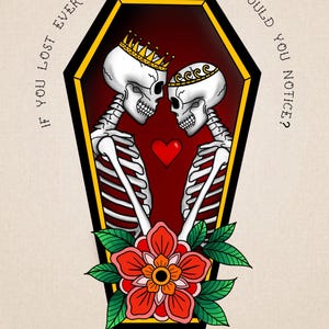 May include: A black and white illustration of two skeletons wearing crowns, embracing inside a coffin. The skeletons are holding a red heart. The coffin is surrounded by a yellow border and a red flower with green leaves.