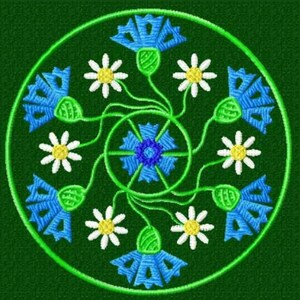 May include: A circular design featuring blue and green flowers with white centers. The flowers are arranged in a symmetrical pattern around a central blue and green flower.