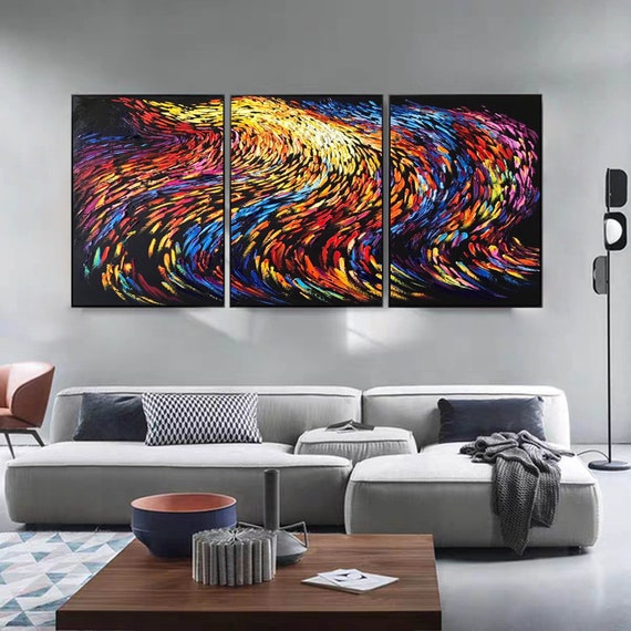 Thick impasto triptych with swirling rainbow color fields — the kind of textured original canvas work where you can actually see the palette knife strokes from across the room.