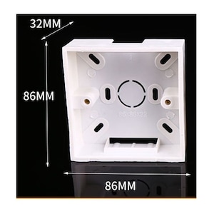 May include: White plastic electrical box with four mounting holes and a center opening. The box measures 86 mm by 86 mm by 32 mm.