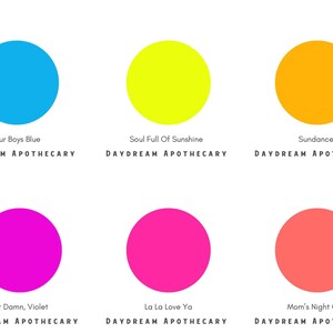 May include: Six colorful circles with names underneath each circle. The colors are blue, yellow, orange, magenta, pink, and coral. The names are Four Boys Blue, Soul Full Of Sunshine, Sundance, Hot Damn, Violet, La La Love Ya, and Mom's Night Out. The text below each name is DAYDREAM APOTHECARY.