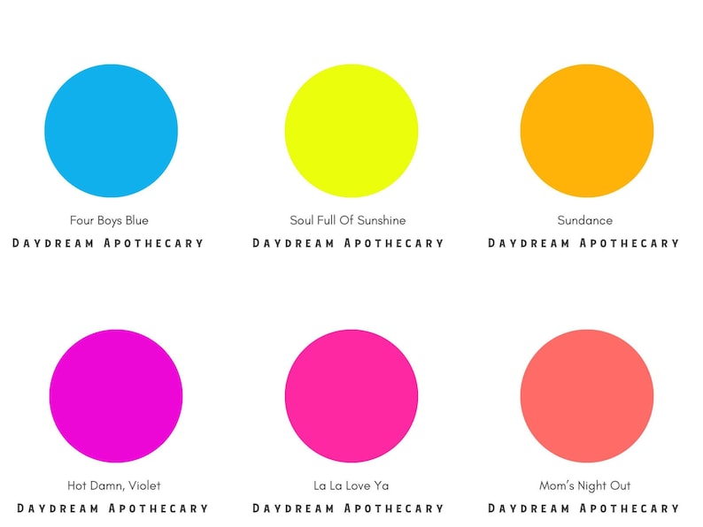 May include: Six colorful circles with names underneath each circle. The colors are blue, yellow, orange, magenta, pink, and coral. The names are Four Boys Blue, Soul Full Of Sunshine, Sundance, Hot Damn, Violet, La La Love Ya, and Mom's Night Out. The text below each name is DAYDREAM APOTHECARY.