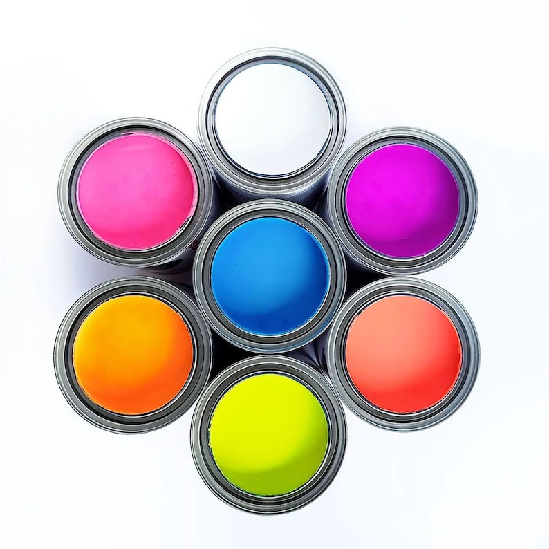 May include: Seven paint cans in a circle, each with a different color of paint: white, pink, blue, orange, coral, purple, and yellow.