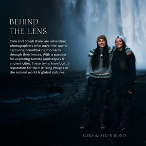 May include: Two women stand in front of a waterfall, smiling at the camera. They are wearing winter clothing, including hats and sweaters. The text "BEHIND THE LENS" is at the top of the image, and the text "CARA & STEPH BONO" is at the bottom of the image.