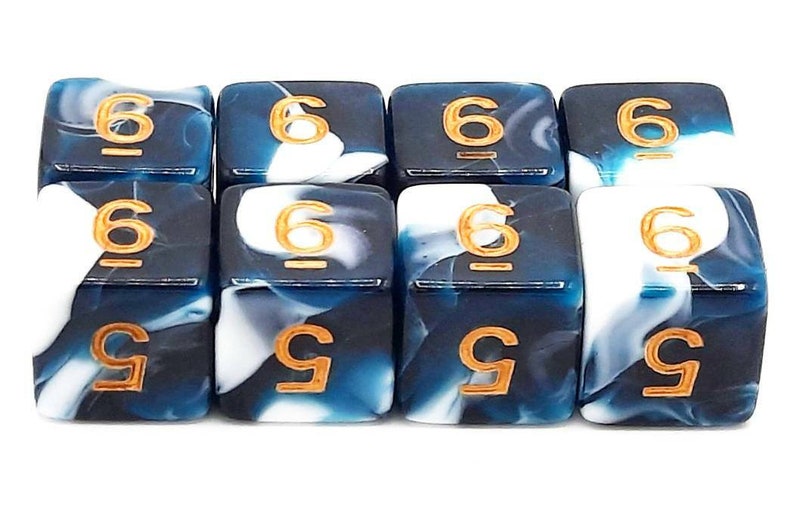 May include: Set of ten blue and white dice with gold numbers. The dice have a swirling pattern and are numbered 6 and 9.