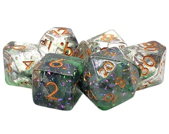 May include: A set of seven iridescent green and clear dice with copper-colored numbers. The dice are scattered on a white background.
