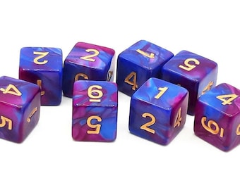 May include: Set of eight marbled dice in shades of blue and magenta with gold-colored numbers. The dice are numbered from one to six and are designed for tabletop games.