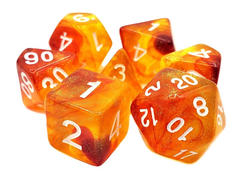 May include: A set of six orange and red dice with white numbers. The dice are translucent and have a swirling pattern inside.