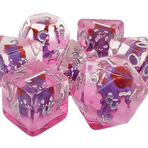 May include: Set of seven pink and purple dice with silver numbers. The dice are translucent and have a swirl pattern.