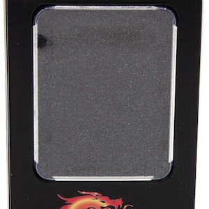 May include: Black rectangular tin with a clear plastic window. The tin features a red and yellow dragon logo with the text "Old School Dice & Accessories". The tin is designed to store dice.