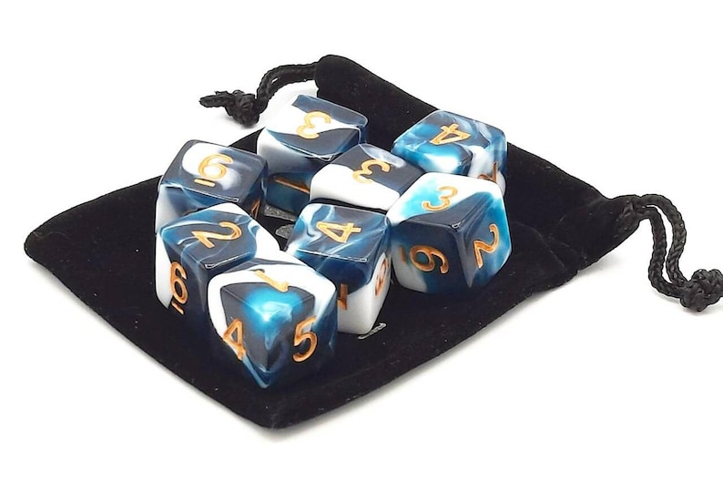 May include: A set of ten blue and white dice with gold numbers in a black velvet bag. The dice have a marbled pattern.