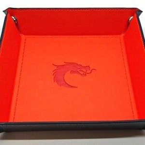 May include: Red felt dice rolling tray with a black border and a red dragon logo in the center.