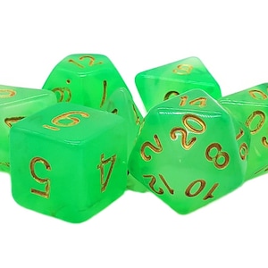 May include: Set of seven translucent green polyhedral dice with gold-colored numbers. The dice are in various shapes, including a d20, d12, d10, d8, d6, and d4. Ideal for tabletop games, these dice are a vibrant addition to any collection.