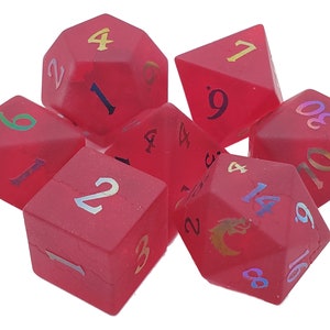 May include: A set of seven red dice with iridescent numbers. The dice are a d4, d6, d8, d10, d12, d20, and a d%.