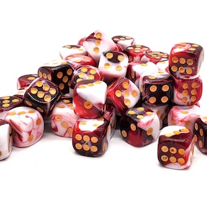 May include: A pile of red and white swirl dice with gold dots. The dice are made of a translucent plastic material.