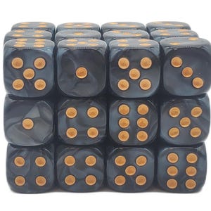 May include: A collection of sixteen dark gray dice with gold-colored pips. The dice are arranged in a cube shape, with each die showing a different number of pips from one to six. The dice have a marbled appearance.