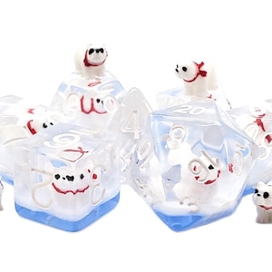 May include: Set of six clear, ice-themed dice with white polar bear figures and red accents. The dice are numbered 4, 6, 8, 10, 12, and 20.