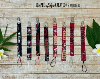 Football Designs / NFL Fabric / Customized Soother Clip / Football Fabric Pacifier Holder / Personalized Name Clip / New Daddy Baby Gift