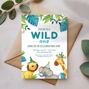 May include: A party invitation with the text "OSCAR IS A WILD one" in teal. The invitation features watercolor illustrations of a lion, elephant, and giraffe, all wearing party hats. Green and blue foliage frames the top.