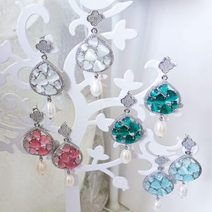 &quot;Drop-Leaf Clover&quot; drop earrings in bronze, pearls, zirconia, and cat&#39;s eye.
