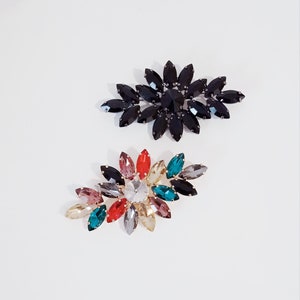 &quot;M & N&quot; brooch with crystals on a steel base