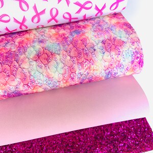 May include: Four sheets of pink patterned faux leather. The top sheet has a white background with pink ribbon designs. The second sheet has a pink, purple, and white tie-dye pattern with a subtle glitter finish. The third sheet is a solid light pink. The bottom sheet is a bright pink glitter fabric.